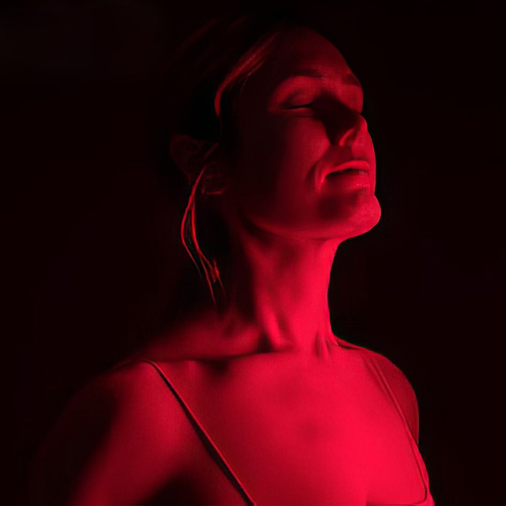 Woman using Bio Light 7000 for Improved Skin Health